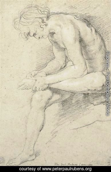 A nude youth in the pose of the Spinario